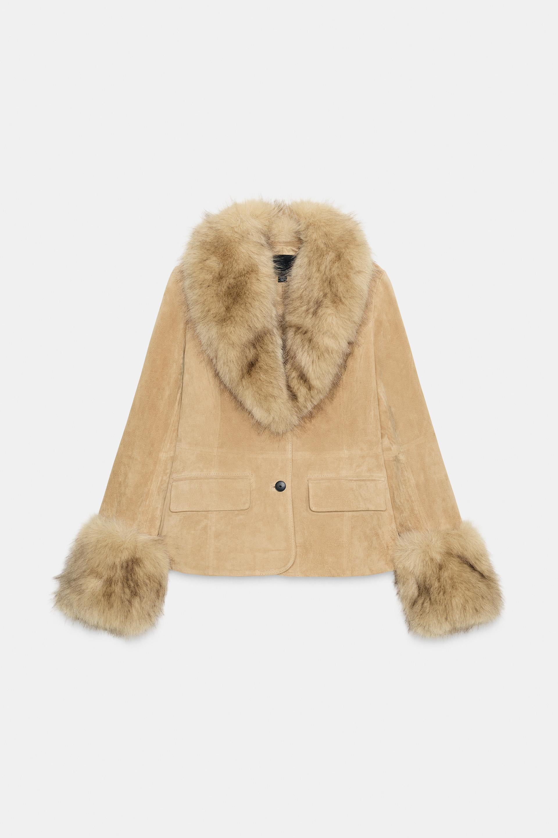 Beige coat with fur trim on a white background